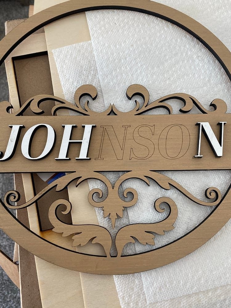 Gluing Name Letters on Front Door Sign Design