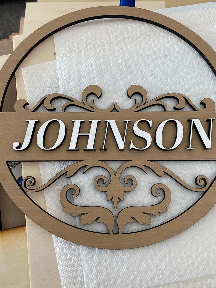 Gluing Remaining Name Letters on Front Door Sign Design